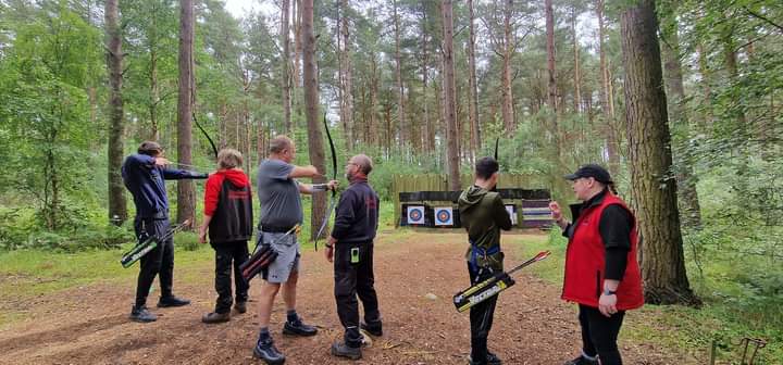 Family enjoying a target archery session
