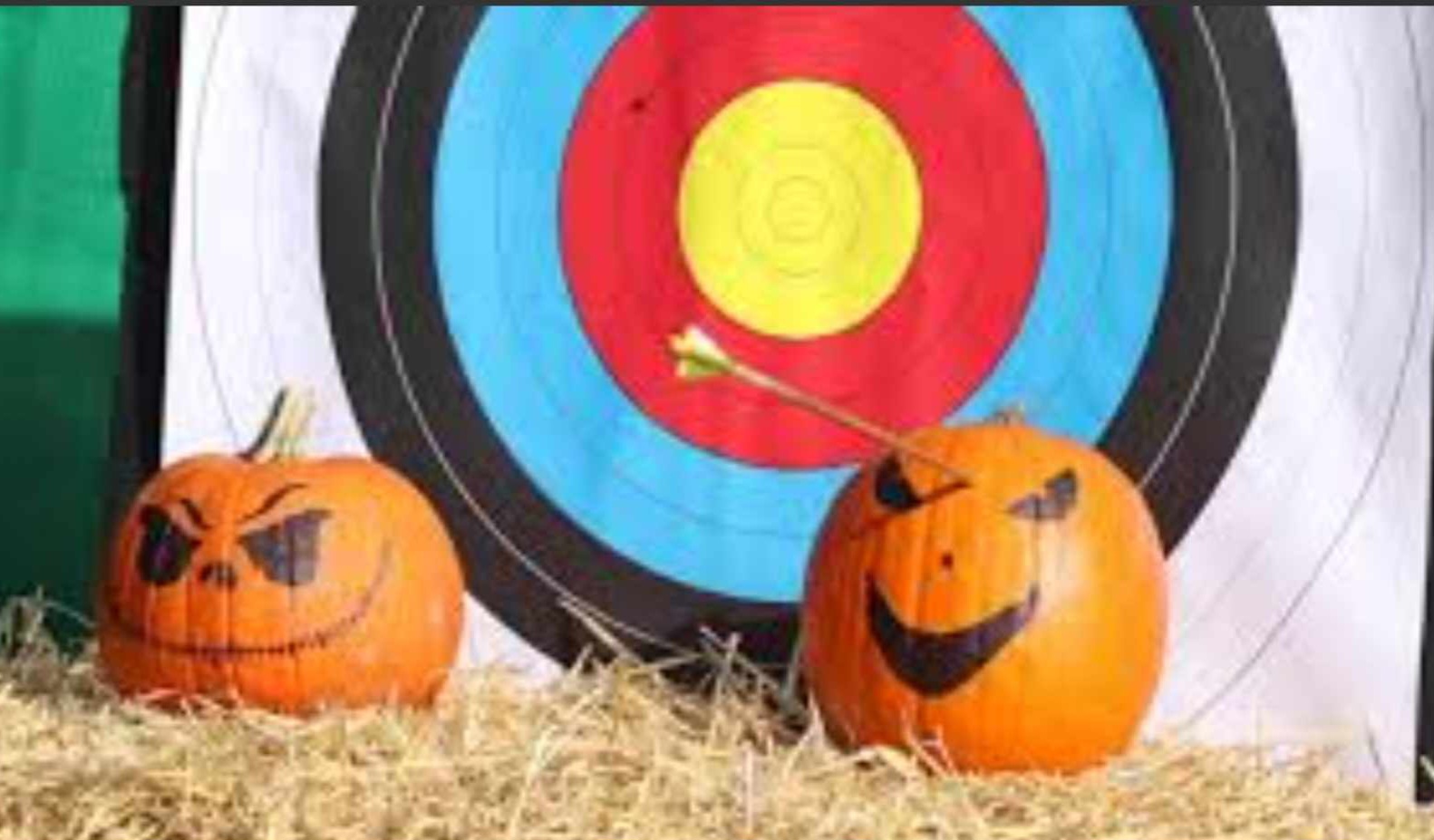 Two pumpkins, archery. Arrow in pumpkin