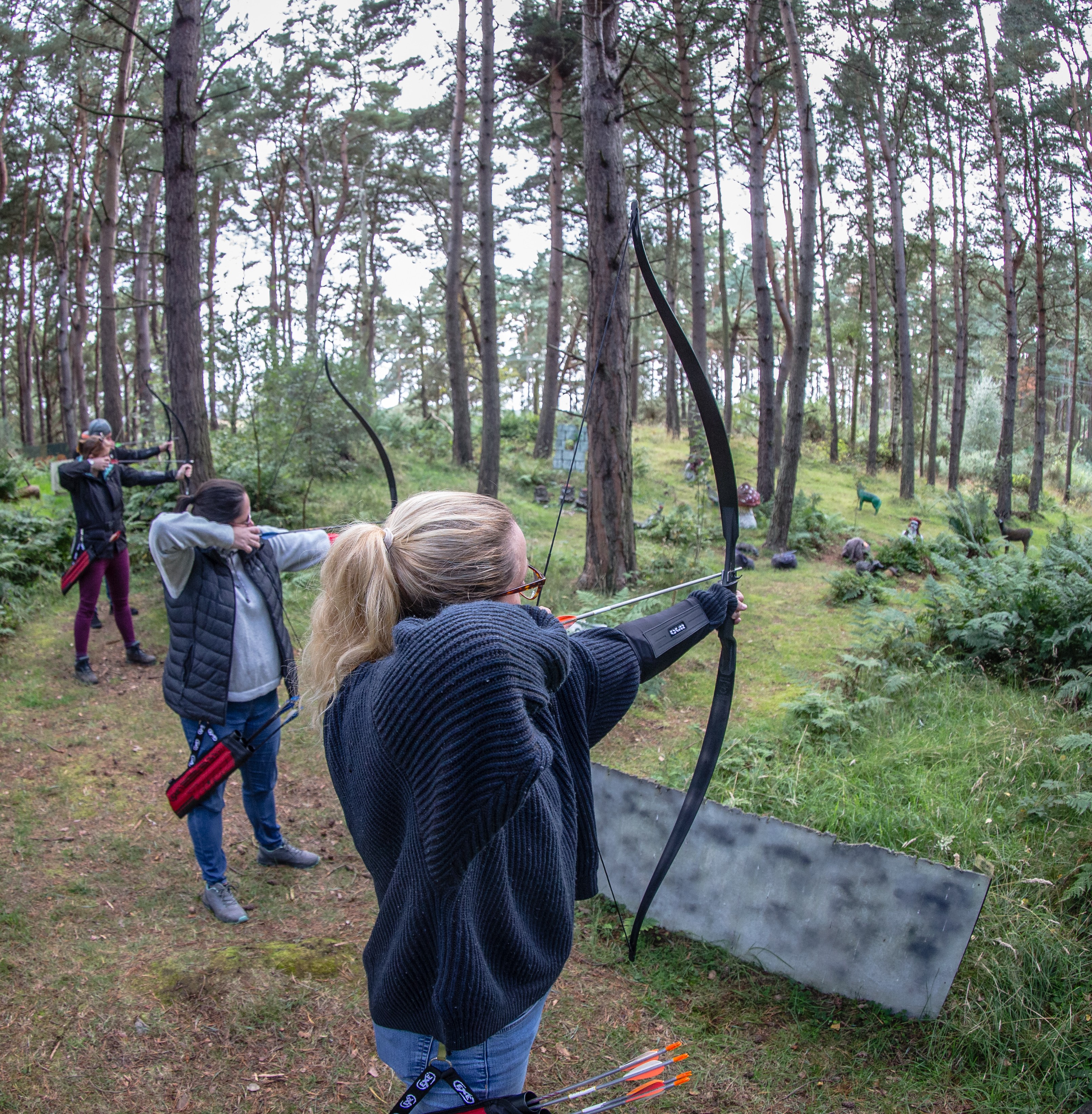 groups of archers in highland glen