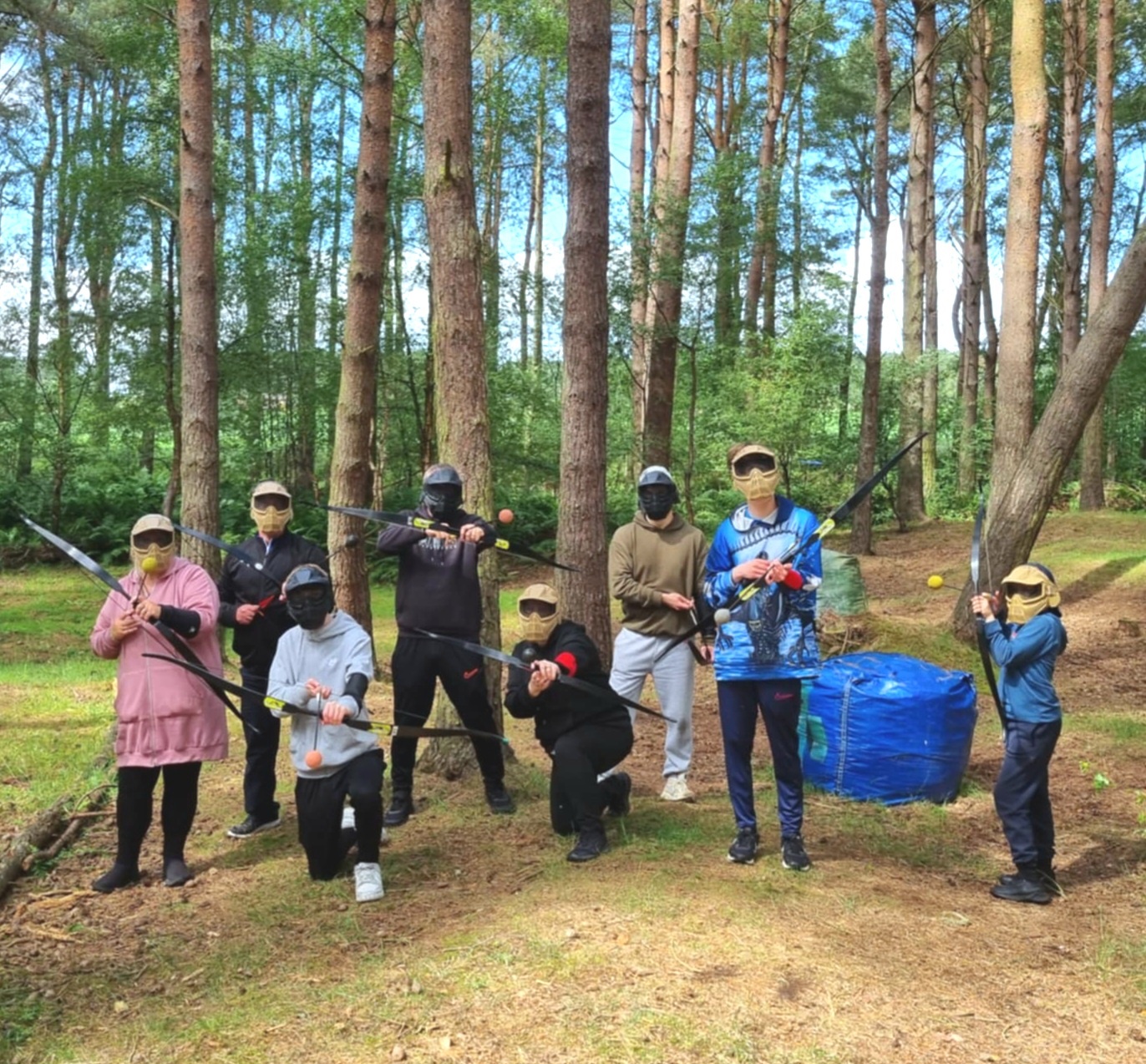 Family participating in the fun combat archery game