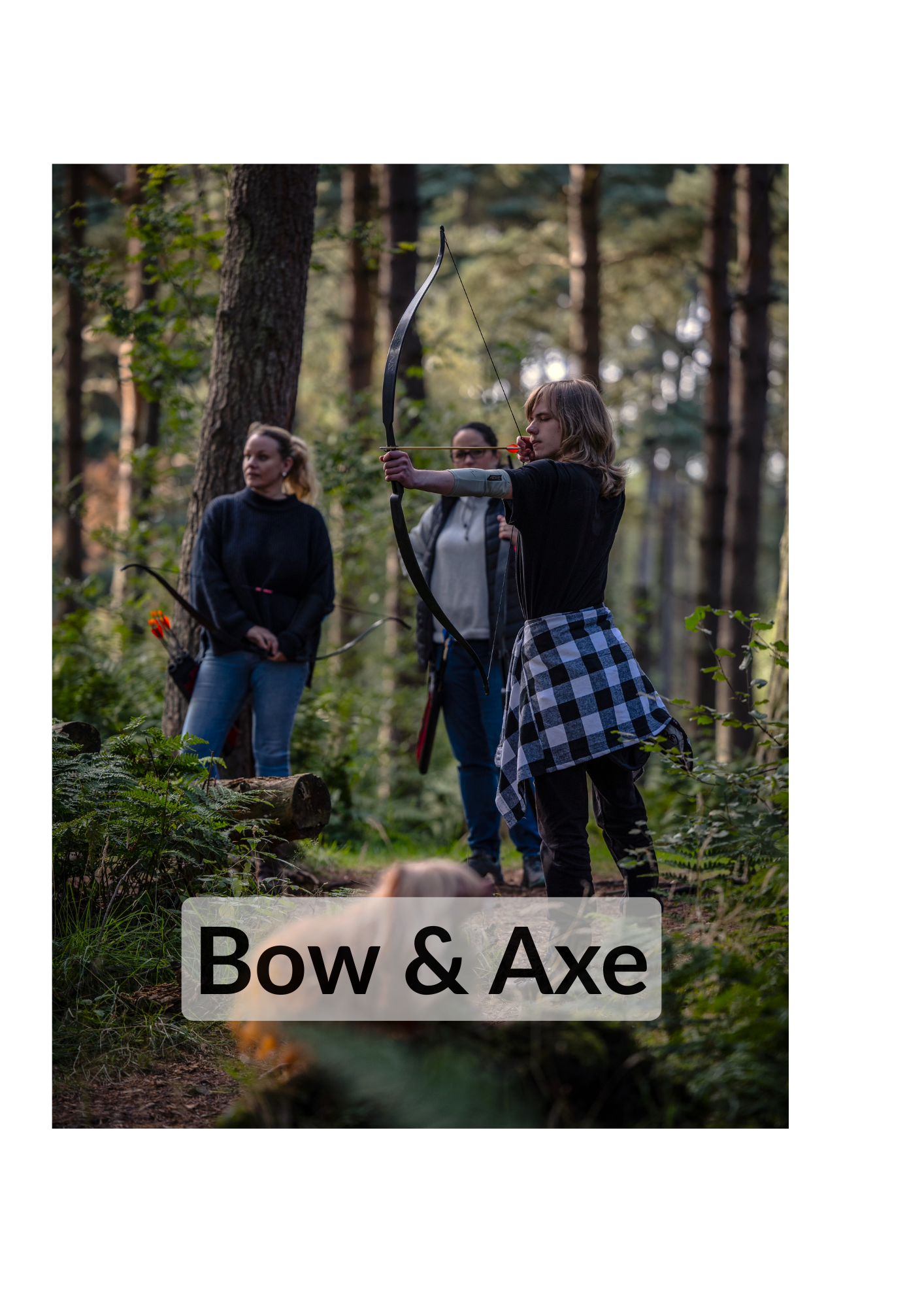 A small group of friends doing woodland archery surrounded by lush greenery
